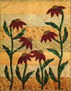 some red flowers are on a quilt