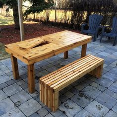 a wooden table and bench on a patio