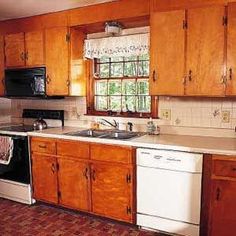 a kitchen with wooden cabinets and white appliances