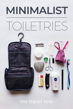 the contents of a travel bag laid out on top of a white sheet with text that reads minimalist toiletries