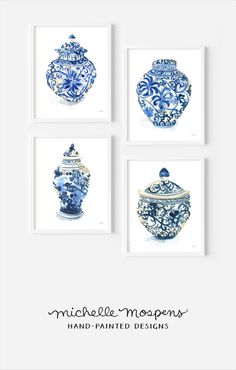 four blue and white vases are displayed on the wall