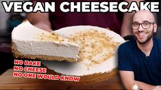 a man sitting in front of a cheese cake