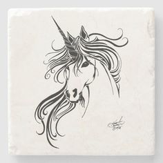 a black and white drawing of a unicorn's head on a stone coaster with swirly hair