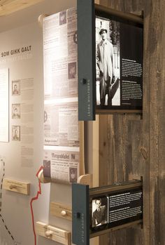 an exhibit with wooden walls and posters on the wall, along with information about men's lives