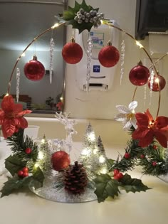 christmas decorations are arranged on a counter top