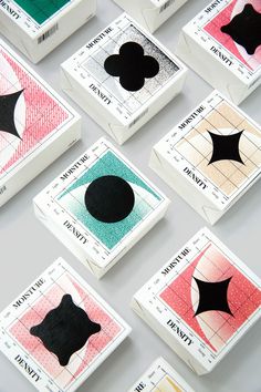 many different types of match cards on a table with one black dot in the middle