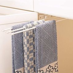 two towels are hanging on a towel rack