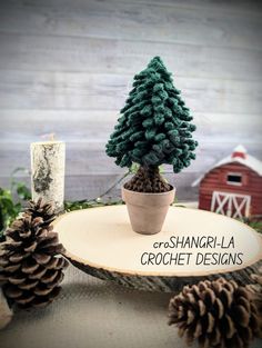 a small pine tree sitting on top of a wooden table