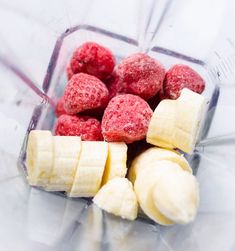 raspberries and bananas are in a blender