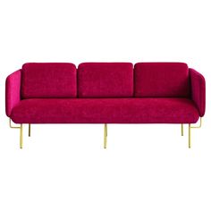 a pink couch with gold legs on a white background