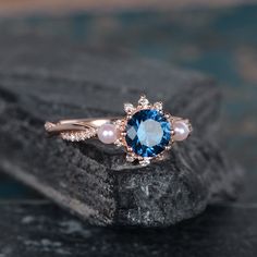 Rose Gold And Pearl Blue Topaz Engagement Ring Infinity Wedding Band Akoya Pearl Birthstone June Bridal Ring Diamond Women Anniversary Gift Same Design with difference gemstone: https://www.etsy.com/listing/612889885 https://www.etsy.com/listing/606125915 https://www.etsy.com/listing/599049598 ITEM INFORMATION: Metal Type- Solid 14K Rose Gold Ring Size Available- US3# -10# *Engagement Ring Details： WIDTH-( approx. 2.3mm ) 1.Center Stone- 6mm Natural Blue Topaz, Round Cut 2.Side Stones - Natural Blue Pearl Engagement Ring, Sapphire Pearl Engagement Ring, Elegant Wedding Jewelry With Topaz, Elegant Topaz Wedding Jewelry, Elegant Topaz Jewelry For Wedding, Elegant Wedding Rings With Gemstone Accents, Elegant Blue Bridal Sets Gift, Rose Gold Sapphire Jewelry For Wedding, Blue Topaz Diamond Wedding Ring