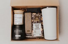 an open box containing coffee, tea and other items to be used as a gift