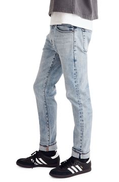 Fitted through the hip and thigh with a straight leg, these are classic, can't-go-wrong slim-fit jeans. Premium Authentic Flex selvedge denim combines a rigid look with all the comfort of stretch. 10 3/4" front rise 98% cotton, 2% polyurethane Machine wash, tumble dry Imported Classic Jeans With Frayed Hem, Fitted Jeans With Five Pockets In Rigid Denim, Fitted Straight Leg Washed Jeans, Classic Straight Jeans With Belt Loops, Straight Rigid Denim Washed Bottoms, Straight Fit Rigid Denim Jeans With Belt Loops, Classic Slim Denim Bottoms, Classic Slim Medium Wash Bottoms, Washed Straight Rigid Denim Bottoms