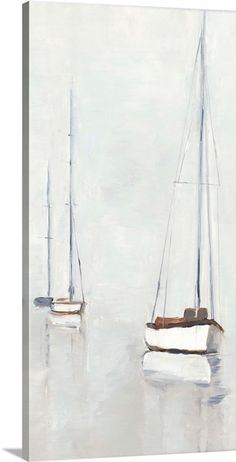 two sailboats floating in the water on a foggy day canvas wall art print