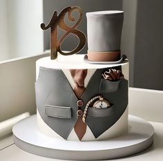 a cake decorated with an image of a man's suit and tie on it