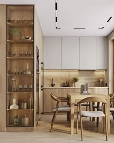 an open kitchen and dining area with wooden furniture