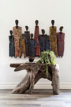 a wooden table topped with a tree trunk