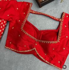 Hand embroidered ready made saree blouse / crop top/stitched saree blouse usa / red saree blouse/ hand embroidered blouse/zardosi blouse/red saree blouse/ blue pure silk blouse/ maggam work blouse        It is very true that a perfect blouse is the one which makes your saree look stand out !! If you find one of such a style that you have been wanting to have then dont let it go !! we carry such unique trending blouses that instantly add a stylish look to any saree !!     Well..!! we understand that you may not get in your desired size/pattern, here you go with customization according to your size/pattern which we can deliver in 1-2 weeks of time period !!      Here is a beautiful Hand embroidered saree blouse in beautiful red color that has simple yet unique embroidery on necks and sleeves Trending Maggam Work Blouse Designs, Blouse Designs With Silk Sarees, Red Blouse Handwork Designs, Saree Blouse Hand Work, Silk Saree Blouse Embroidery, Color Neck Blouses For Sarees, Square Blouse Designs, Red Handwork Blouse, Red Blouse Designs Patterns