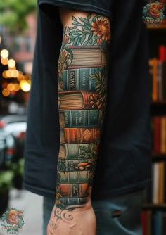 a man's arm with books on it and flowers in the middle is shown