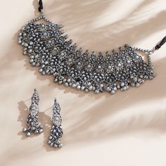 These Indian chokers is oxidized which is created with careful attention to detail. The designer neckpieces & its finishing gives it an elegant look & feel. This design is perfect for parties & functions as these chokers are specially designed for Indian Beautiful Brides -Base Metal- Silver, Brass -Plating- Oxidized Silver/Black Polish/Afghani -Stone- Pearls -Sizing-Non Adjustable -Type- Chokers -Light Weight -FREE Shipping -Gift Wrapping Available -Delivery from a Small Business in India -Handmade Product Skin Friendly- Lead & Nickel Free in compliance with all International Requirements. Gift - Ideal Valentine, Birthday, Anniversary gift for someone you Love/ Best Friend/Girlfriend. Occasion - Festivals, Wedding, Party Wear, Perfect For Indian Weddings We tried to cover as many details a Indian Black Necklace, Oxidized Finish Necklace For Festivals, Oxidized Choker, Floral Choker, Choker Black, Choker Designs, Oxidized Necklace, Black Choker Necklace, Silver Choker Necklace