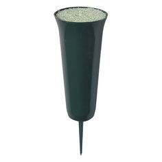 a tall black vase sitting on top of a white floor next to a metal pole