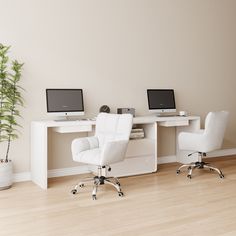 two computer desks sitting next to each other on top of a hard wood floor