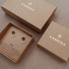 two boxes that have some kind of earrings in them