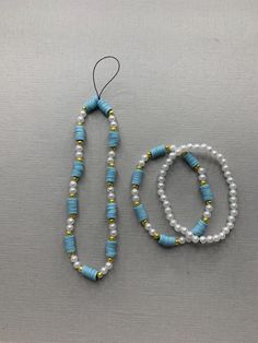 This is a set of a handmade phone charm and two aesthetic bracelets. It's white and blue and has golden details. It's perfect for everyone and every day. Two Aesthetic, Phone Bracelet, Aesthetic Bracelets, Aesthetic Bracelet, Birthday Photography, Charm Set, Phone Charm, Diy Beads, Favorite Jewelry