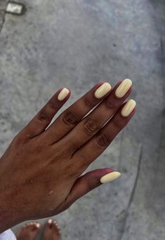 Capture the essence of sunny days with our radiant summer yellow nails! Flash a smile on your hands with a color that's as warm and inviting as a sunny afternoon. Spring Minimal Nails, Summer Nails For Tanned Skin, Sheer Yellow Nails, Cream Yellow Nails, Buttery Yellow Nails, Nails With Yellow Dress, Milky Yellow Nails, Yellow Natural Nails, Nails Tanned Skin