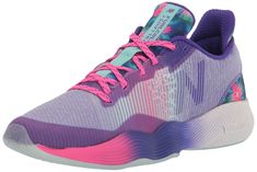 a women's tennis shoe in purple and pink