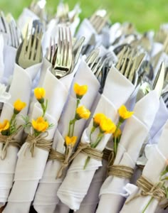 there are many forks and silverware in the basket with yellow flowers on it that says bld happy health