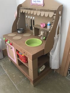 a child's play kitchen made out of cardboard