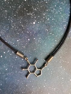 Gotta have that caffeine even if it's in necklace form ;) Caffeine Molecule, Molecule Necklace, Aura, Charm Necklace, Charms, Necklace Etsy, Jewelry Necklaces, Black