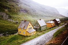 small houses on the side of a mountain road