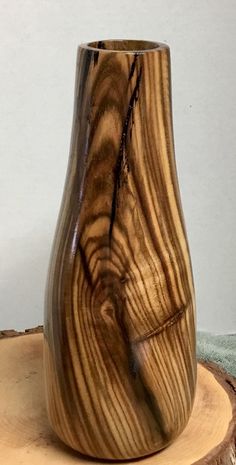 a wooden vase sitting on top of a tree stump