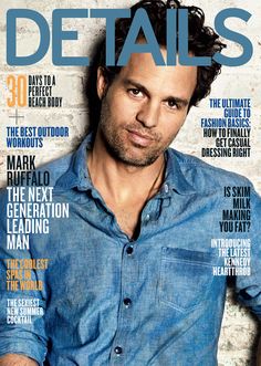 a man in blue shirt on the cover of a magazine with his arms folded out