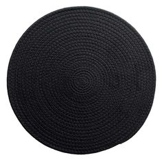 a round black rug is shown on a white background, with the center circle made out of braiding