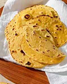 some tortillas are sitting on a napkin