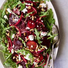 a salad with beets, feta cheese and nuts