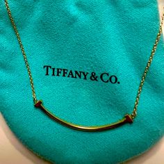 Never Worn, New In Box, Tiffany & Co. 18k Gold Smile Necklace, Approximately 16.5” Long, With Adjustable Chain To Wear As A Choker, If Desired. Retails For $1100 + Tax On Company Website. Thanks For Looking & Happy Bidding! Smile Necklace, Jewelry Tiffany, Tiffany T, Yellow Gold Color, Necklace With Pendant, Company Website, Tiffany Co Jewelry, Tiffany & Co., Red Gold