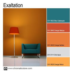 an orange and teal color scheme for a living room with a blue chair in the corner