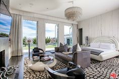 a living room filled with furniture and a flat screen tv