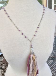 This whimsical necklace is made with sari silk, ribbon and lace.  The 6mm purple beads are lepidolite and the chain and toggle clasp are silver plated.  There is one faceted iridescent bead that catches the light beautifully.  The total length is 40 inches. Bohemian Silver Amethyst Beaded Necklace, Adjustable Bohemian Lavender Crystal Necklace, Bohemian Lavender Beaded Crystal Necklace, Sari Silk Necklace, Whimsical Necklace, Sari Silk Ribbon, Silk Necklace, Ribbon Jewelry, Purple Beads