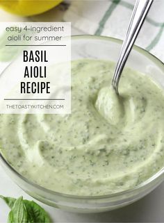 basil aioli recipe in a glass bowl with a spoon