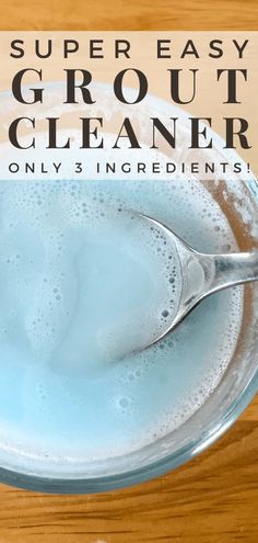 a glass bowl filled with liquid and a spoon on top of it that says, super easy grout cleaner only 3 ingredients