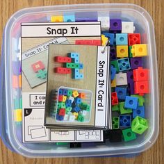 a plastic container filled with lots of colorful legos