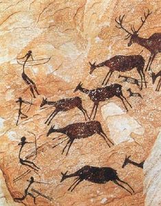 an image of some animals and people on a rock wall with other animal paintings in the background