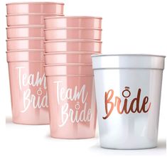 the bride and groom's cups are lined up against each other with their names on them