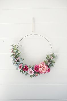 a floral wreath hanging on the wall