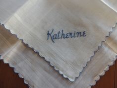 embroidered name on white cloth with scalloped edges that say, kahlhenne